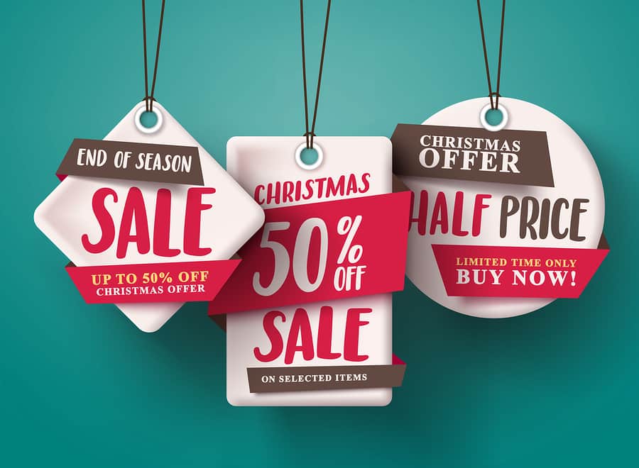 End of season Christmas sale tags hanging with half price text and with origami paper style for holiday discount promotion.